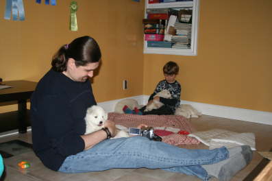 Boys cuddle time with the puppies